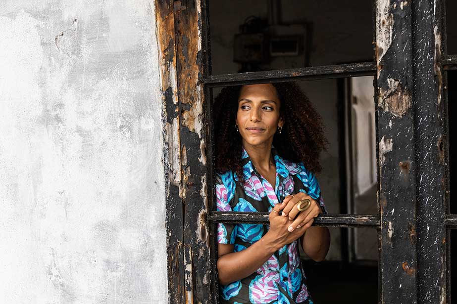 Afua Hirsch looking out of the Governors room window in Elmina Castle, Ghana.