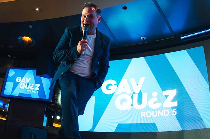 Gavin Inskip on stage hosting Gav Quiz
